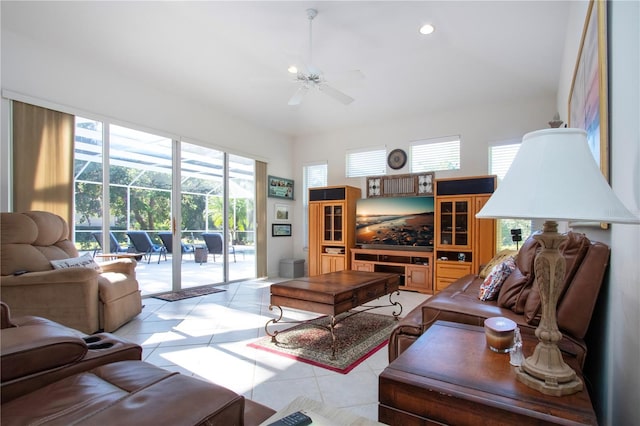 tiled living room featuring a wealth of natural light and ceiling fan