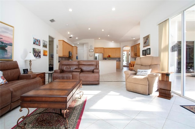 tiled living room featuring lofted ceiling