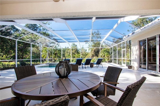 view of patio / terrace featuring glass enclosure