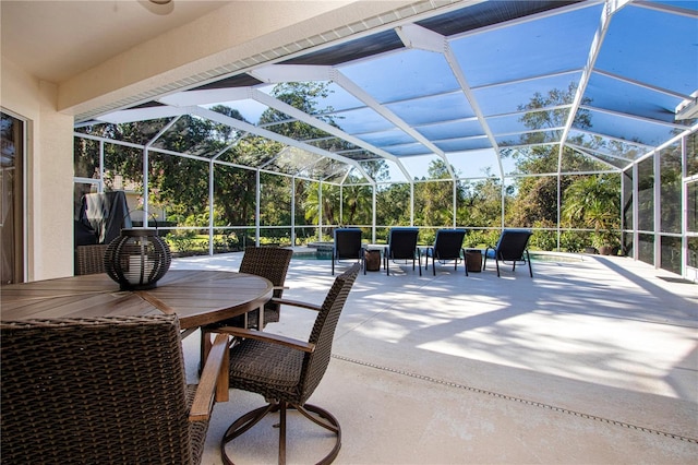 view of patio / terrace featuring glass enclosure