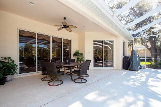 view of patio with a lanai and ceiling fan