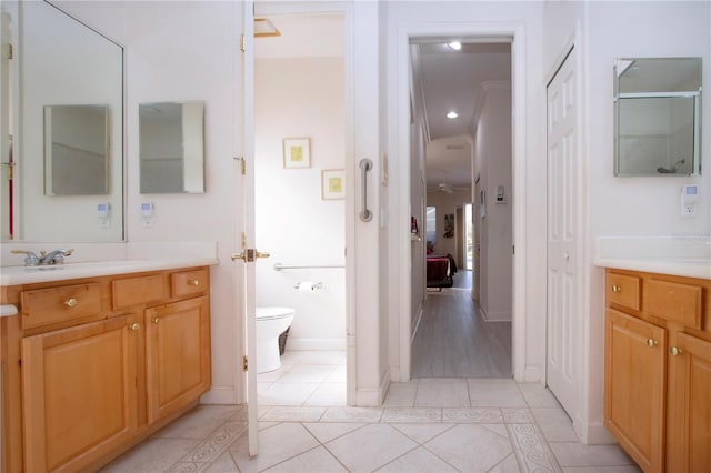 bathroom with tile patterned floors, vanity, and toilet