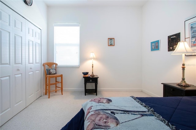 carpeted bedroom with a closet