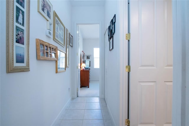 corridor featuring light tile patterned floors