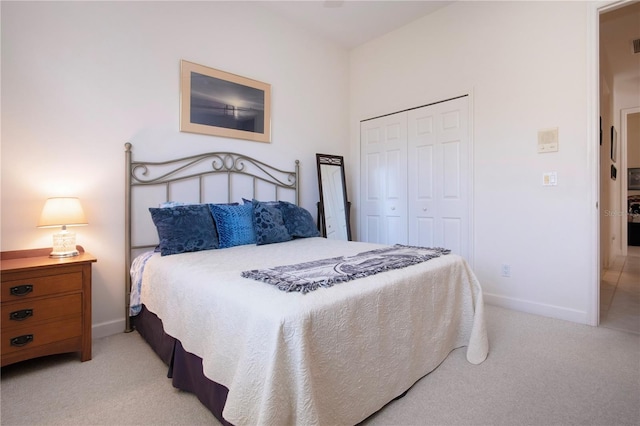 carpeted bedroom with a closet