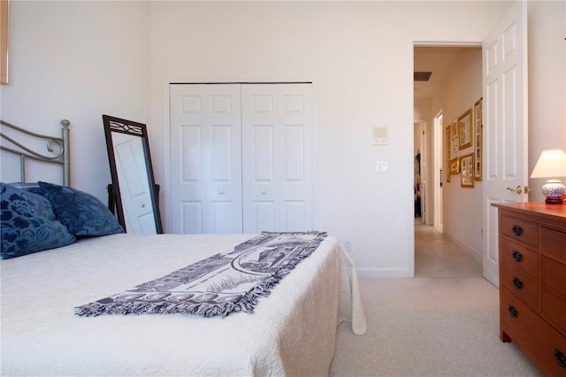 carpeted bedroom with a closet