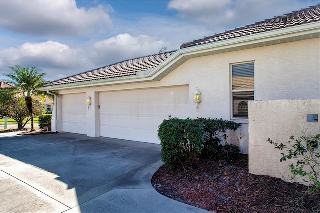 view of property exterior featuring a garage