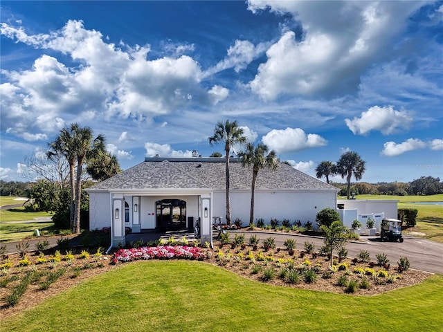 view of front of home with a front yard