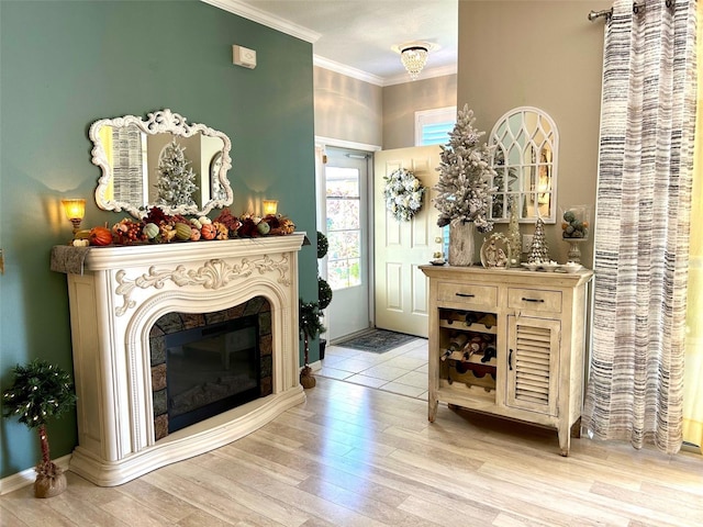 interior space featuring light hardwood / wood-style flooring and ornamental molding