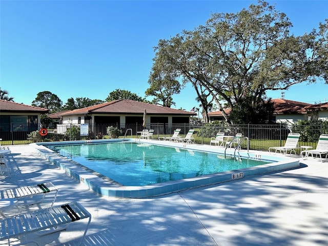 view of swimming pool featuring a patio