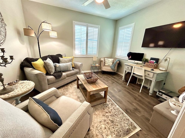 living room with ceiling fan, hardwood / wood-style floors, and a textured ceiling