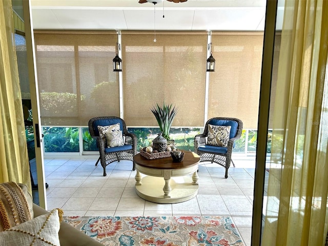 sunroom featuring a ceiling fan