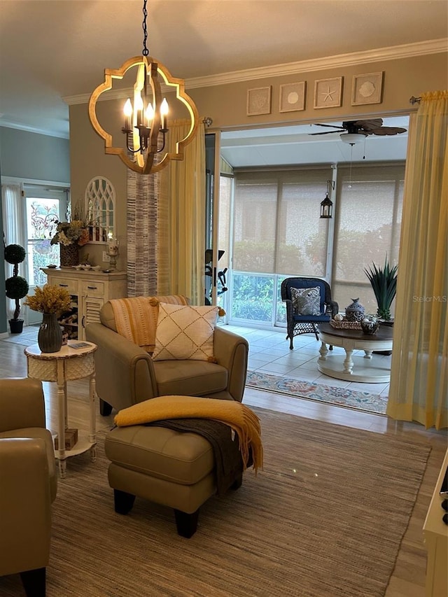 living area with crown molding and ceiling fan with notable chandelier