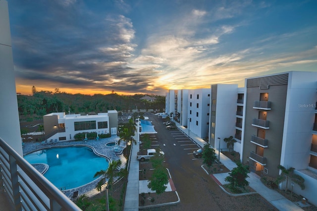 view of pool at dusk