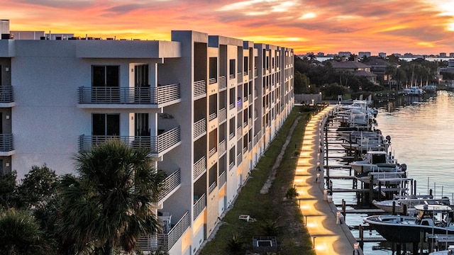 outdoor building at dusk featuring a water view