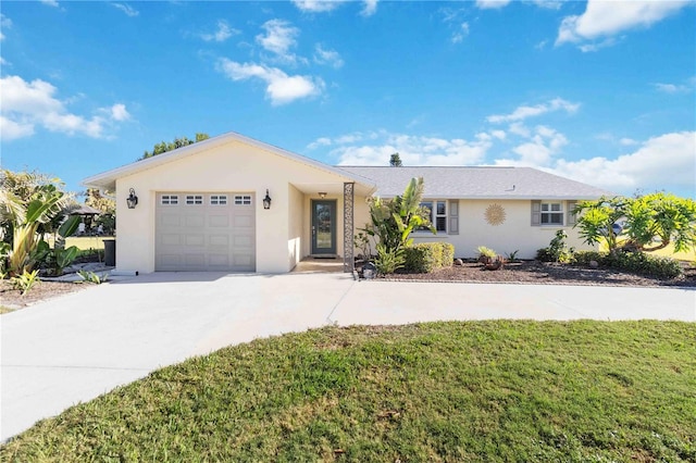 single story home featuring a garage and a front lawn