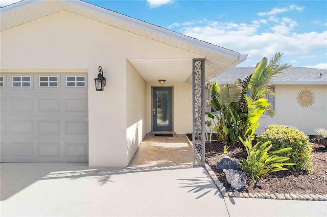 entrance to property featuring a garage