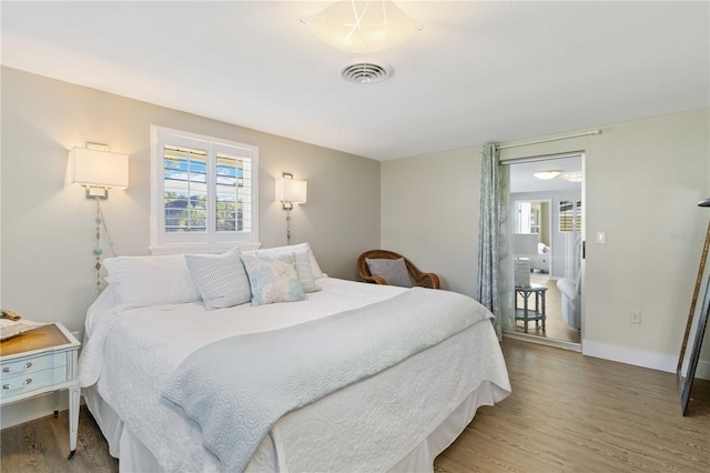 bedroom featuring hardwood / wood-style floors