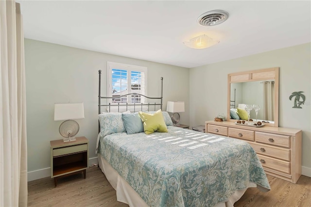 bedroom with light wood-type flooring