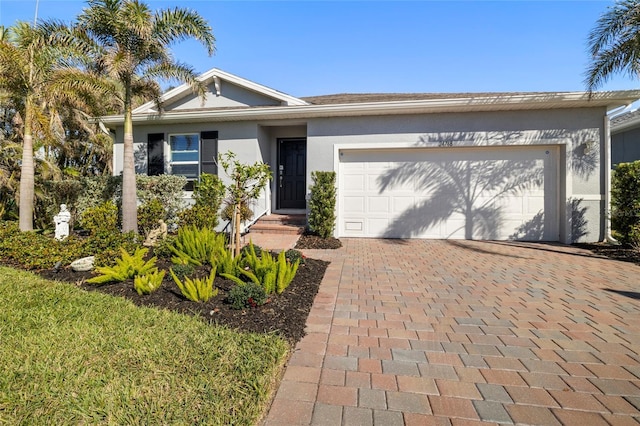 single story home featuring a garage