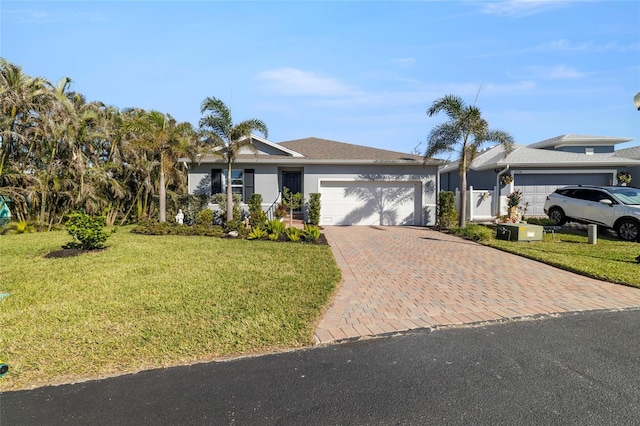 single story home featuring a front yard and a garage