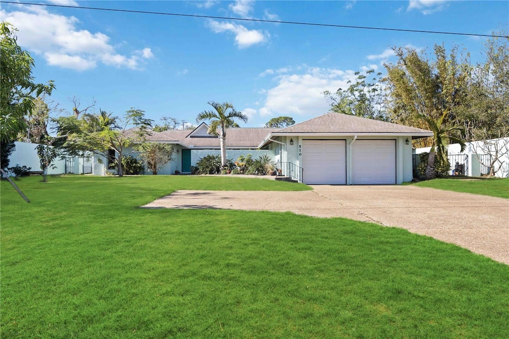 ranch-style house featuring a front yard and a garage