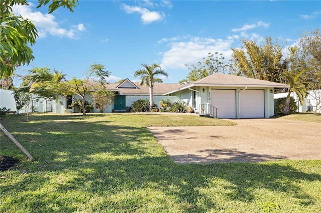 ranch-style house featuring a front yard and a garage