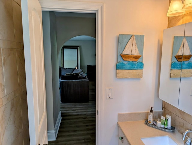 bathroom featuring vanity and hardwood / wood-style flooring