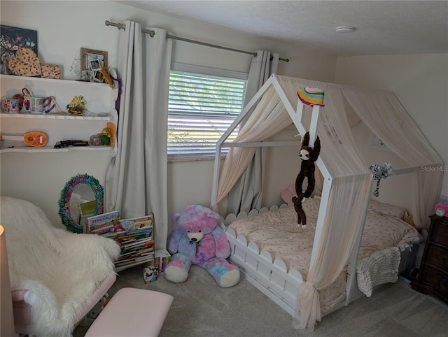 carpeted bedroom with a textured ceiling