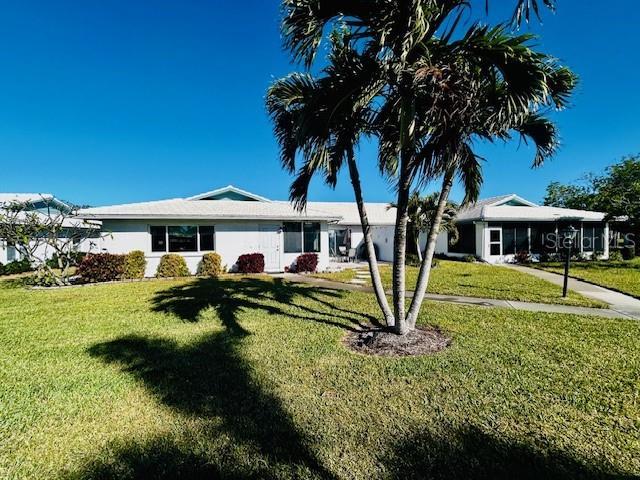 view of front of home with a front lawn