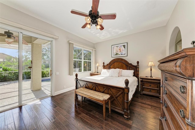 bedroom featuring ceiling fan, dark hardwood / wood-style floors, lofted ceiling, and access to outside