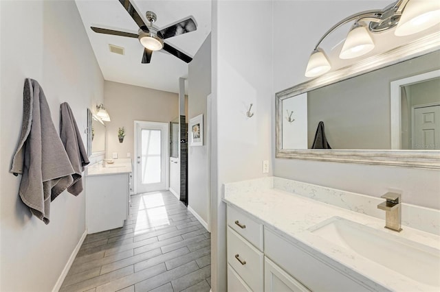 bathroom featuring ceiling fan, wood-type flooring, and vanity