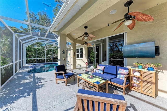 view of patio with glass enclosure and an outdoor hangout area