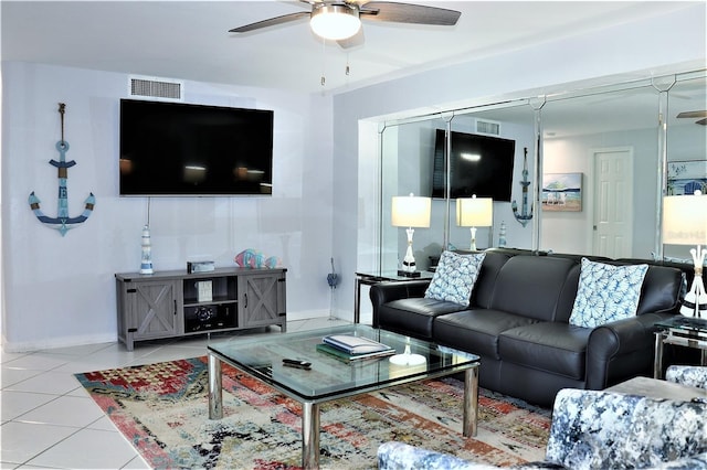 living room featuring light tile patterned floors and ceiling fan