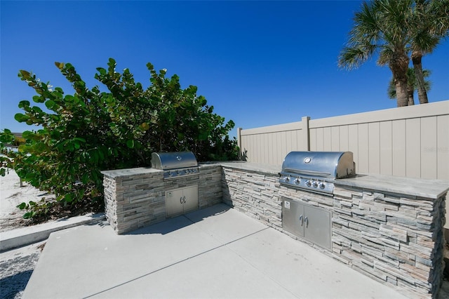 view of patio with a grill and exterior kitchen