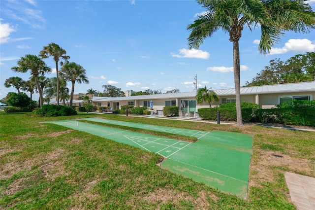 view of home's community featuring a lawn