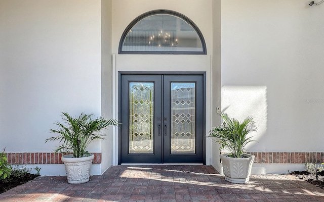 property entrance featuring french doors