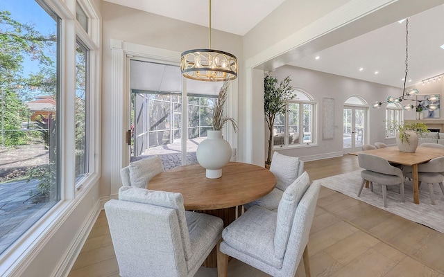 dining room featuring light tile patterned floors and an inviting chandelier