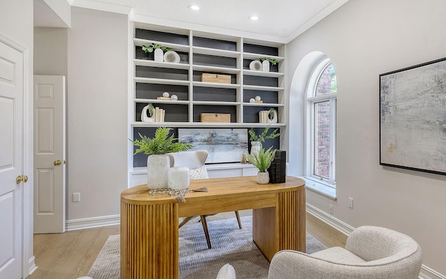 office space featuring light hardwood / wood-style floors and ornamental molding