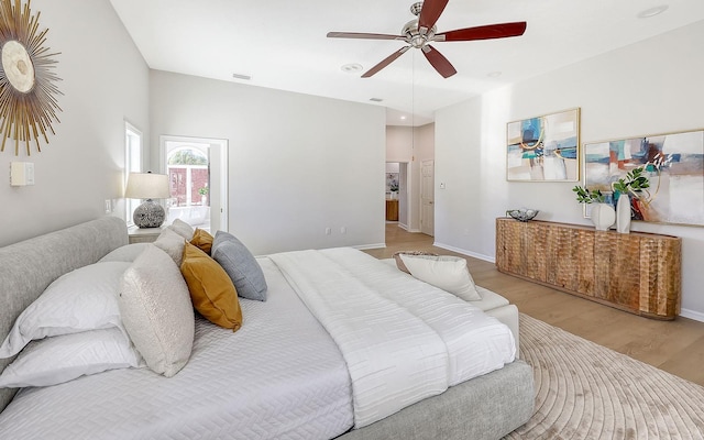 bedroom featuring ceiling fan and light hardwood / wood-style floors