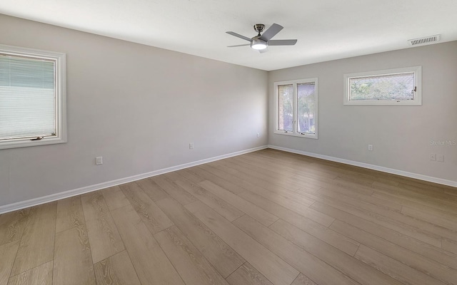 empty room featuring light hardwood / wood-style floors and ceiling fan