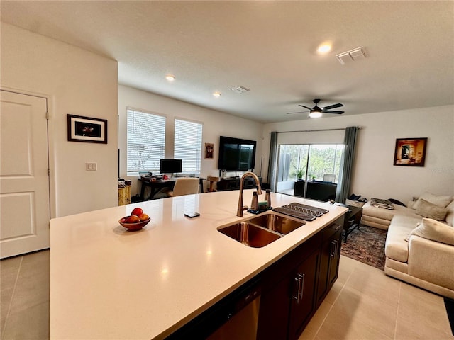 kitchen featuring a center island with sink, ceiling fan, light tile patterned floors, and sink