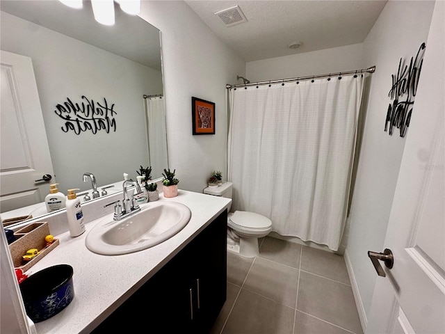 full bathroom featuring toilet, shower / bath combination with curtain, vanity, and tile patterned floors