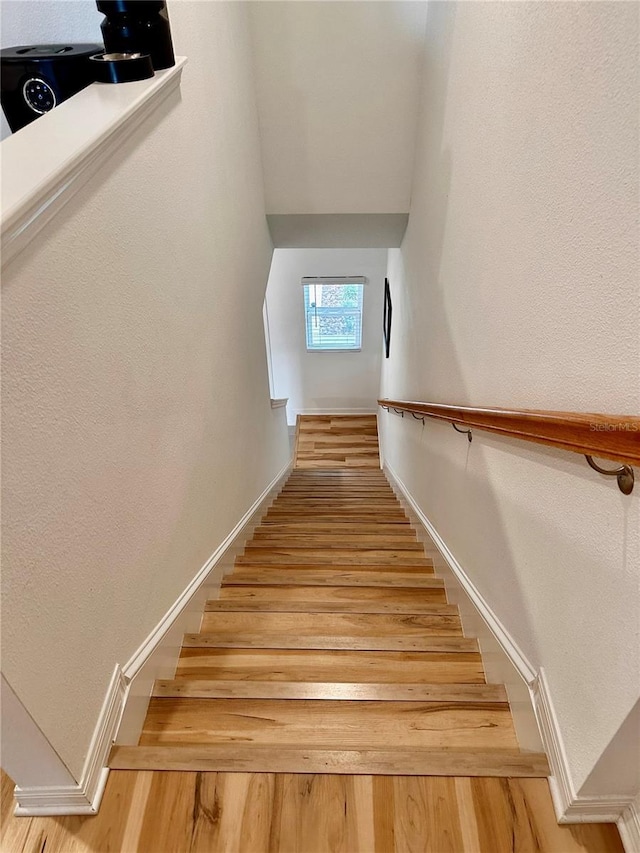 staircase featuring hardwood / wood-style flooring