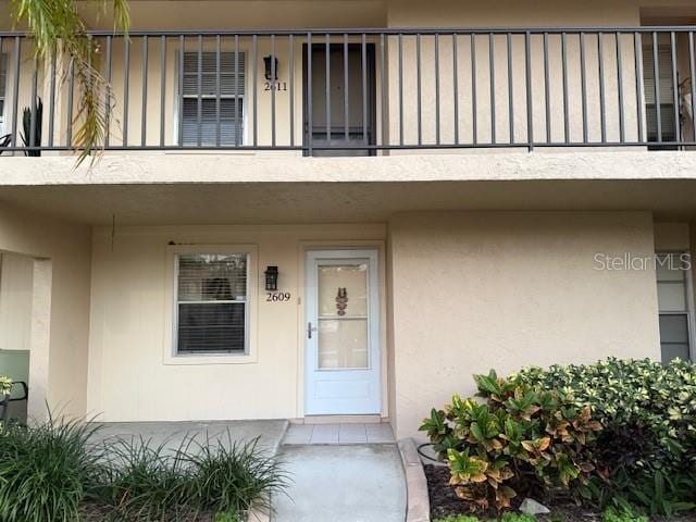 property entrance with a balcony