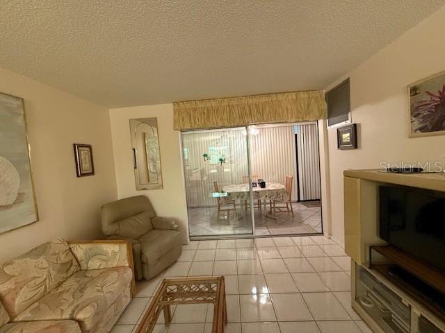 tiled living room with a textured ceiling