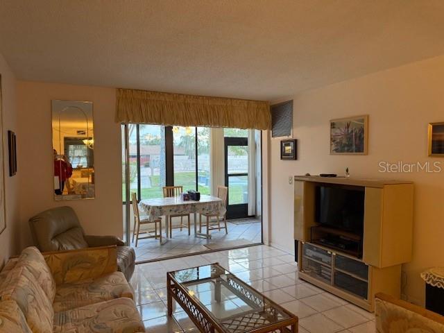 living room featuring light tile patterned floors