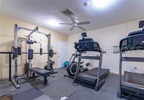 exercise area with ceiling fan