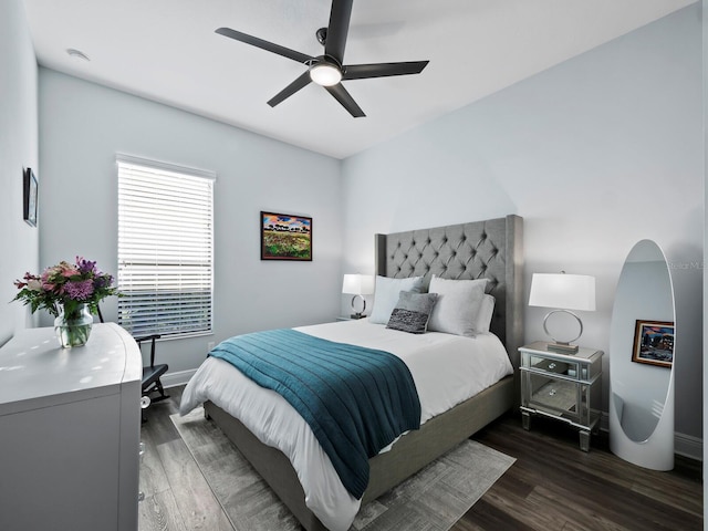 bedroom featuring ceiling fan and dark hardwood / wood-style flooring