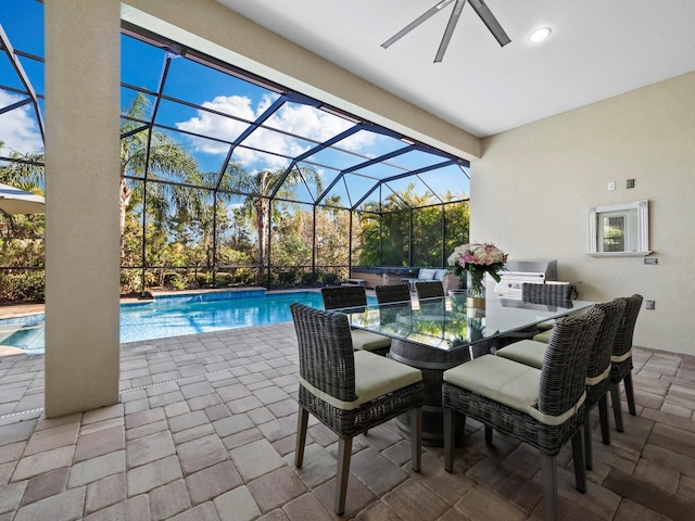 view of pool featuring glass enclosure and a patio